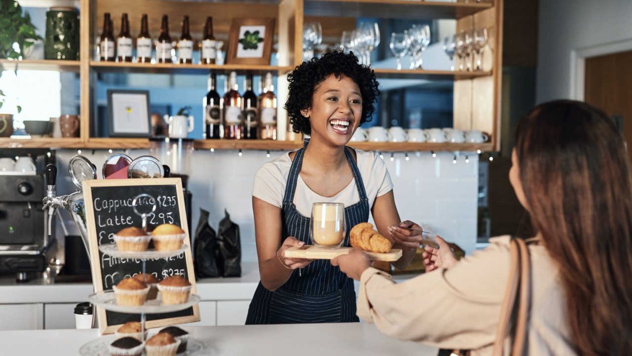 Happy-woman-service-coffee-and-pastries