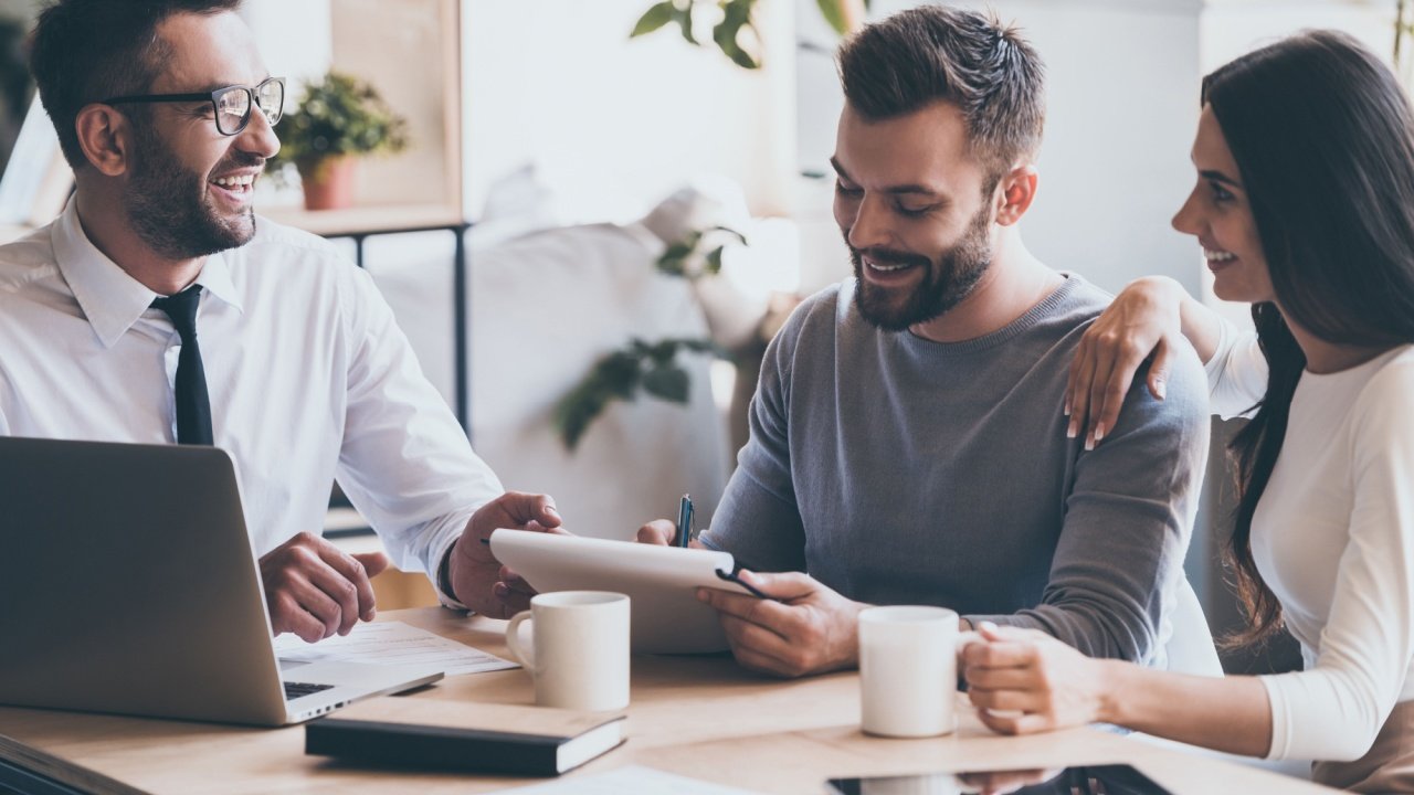 Couple speaking with a financial planner, finances, money